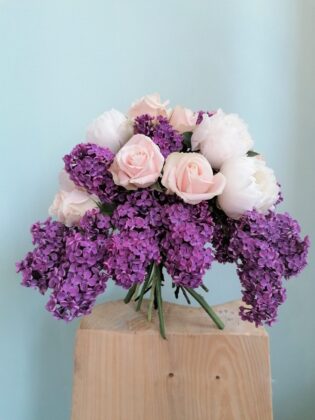 This is a proposal with a smile :) A bouquet fragrant with spring flowers of peonies, lilacs and subtle roses.
