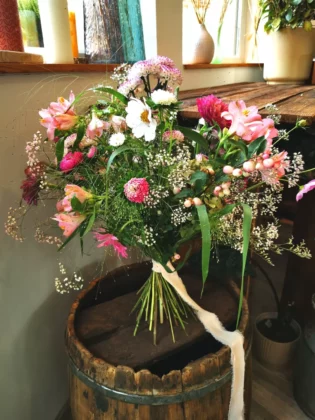 The pink colour has its beautiful counterparts in nature. In this bouquet they are fuchsia zinnias, asters, peachy alstroemerias and pastel margaritas.