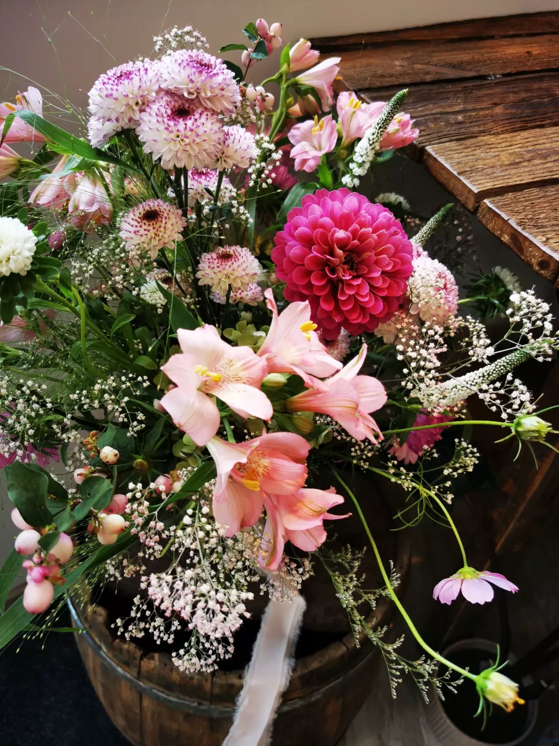 The pink colour has its beautiful counterparts in nature. In this bouquet they are fuchsia zinnias, asters, peachy alstroemerias and pastel margaritas.