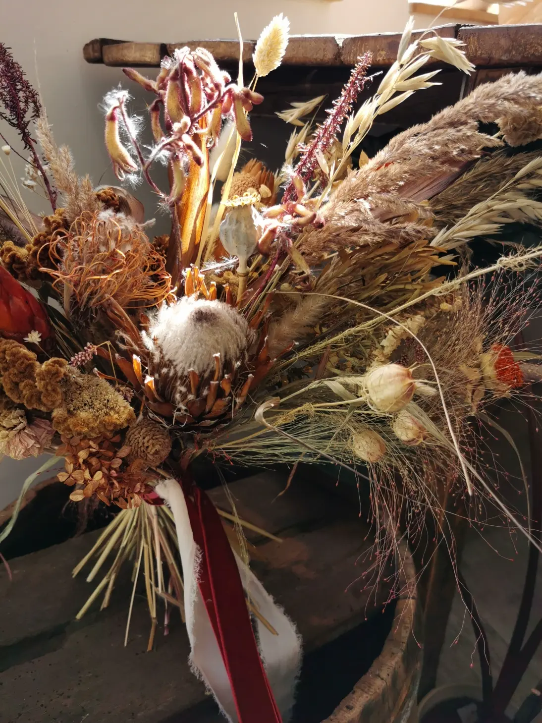 A unique dried plant bouquet, made in the form of a boho style horizontal bouquet. Made entirely of dried plants.