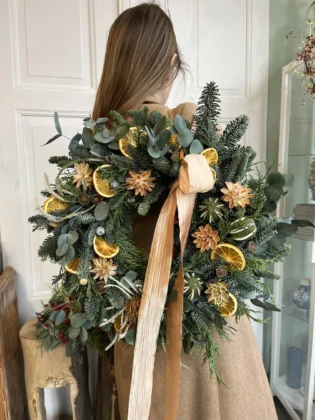 Christmas garland with dried oranges, aniseed and fir tree